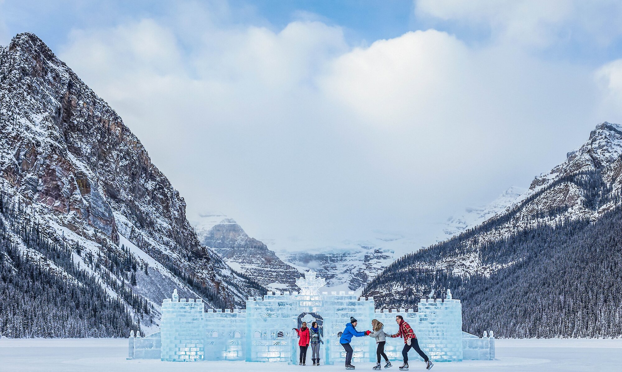 Skaters on Lake Louise in front of the Ice Castle