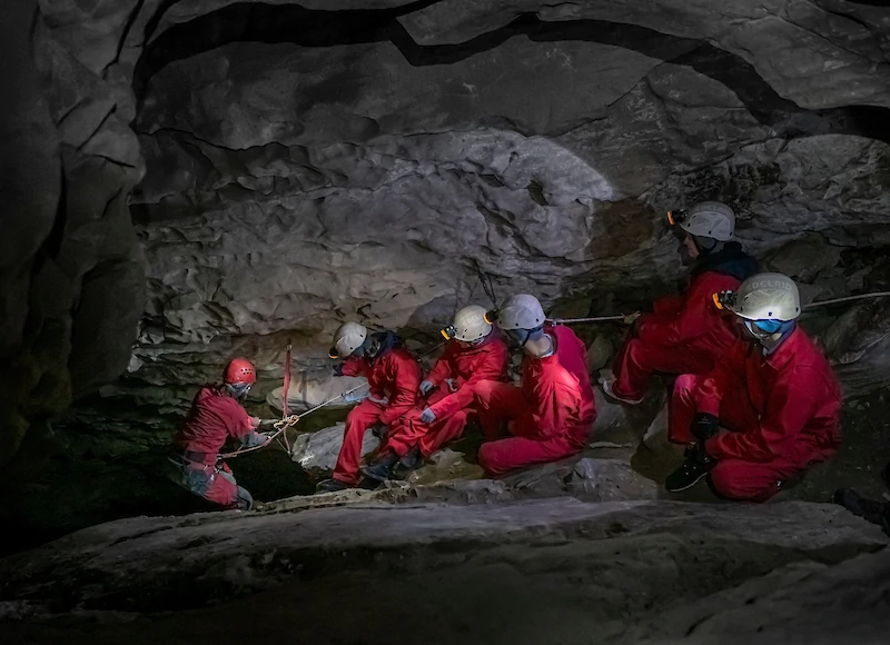 A group of people on a cave tour