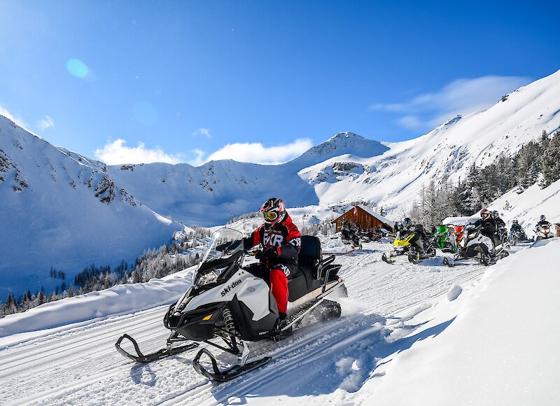 Heading down the trails on a snowmobile tour