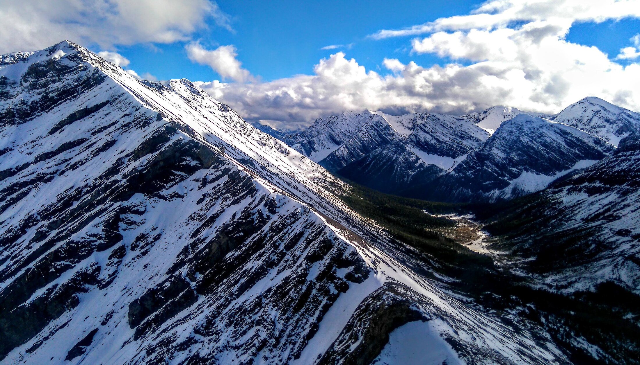 Get a bird's eye view of the Rocky Mountains from a helicopter