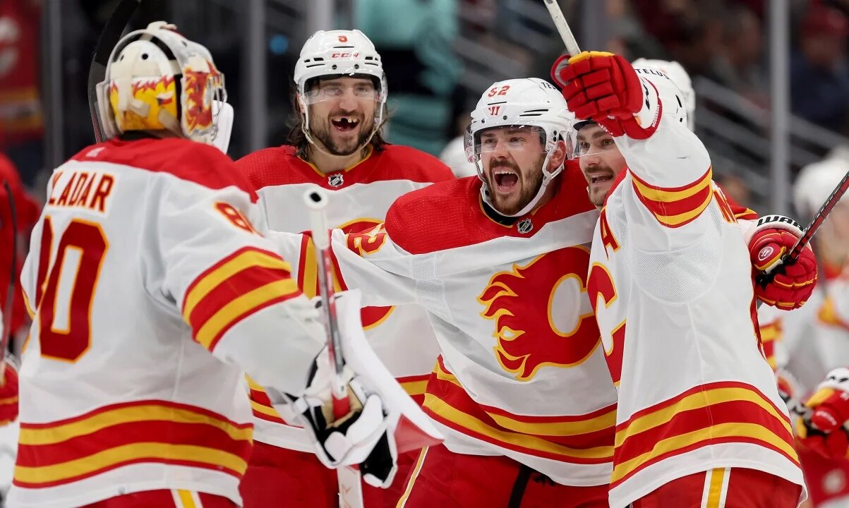 Calgary Flames Hockey players celebrating a goal at the Scotiabank Saddledome in Calgary