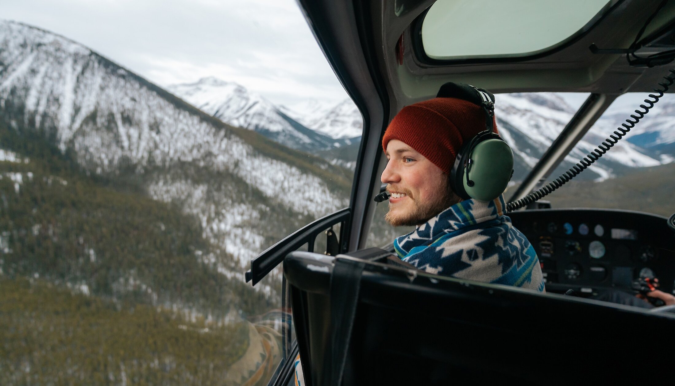 Guest taking in the views on a helicopter flight