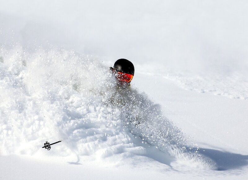 Shredding the deep powder on a heliski adventure