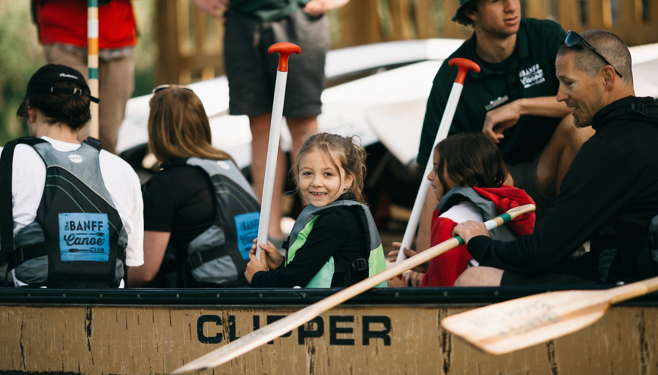 A child excited to head out on a Big Canoe tour on the Bow River in Banff