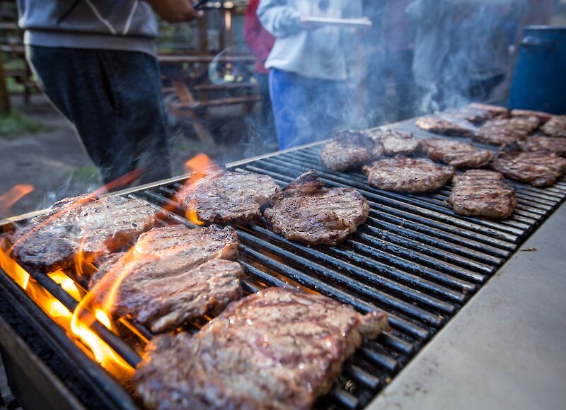 Steaks on the barbecue at the Cowboy Cookout in Banff