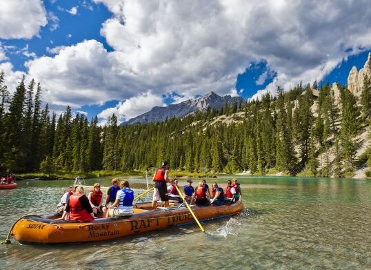 Families rafting down the Bow River, checking out hoodoos