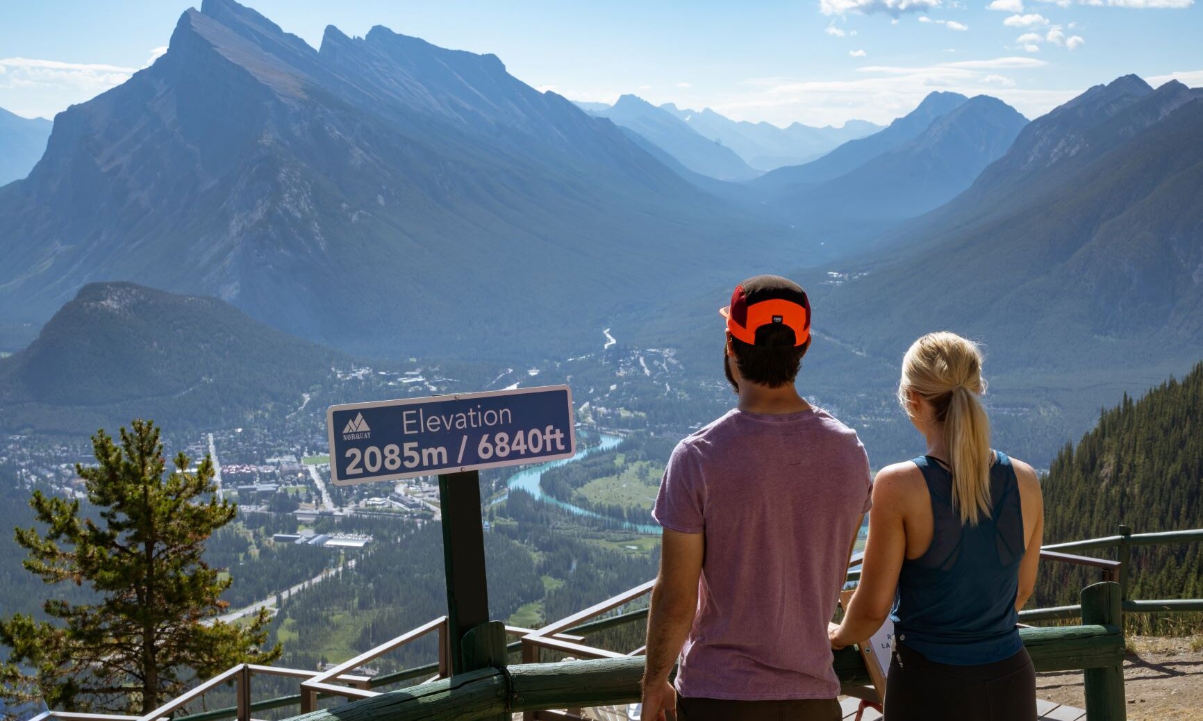 A couple admiring the view from the top of the Mount Norquay Chairlift