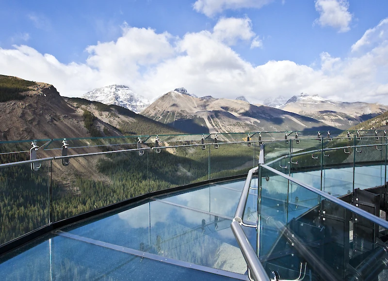 The glass bottom bridge at the Skywalk with mountain views
