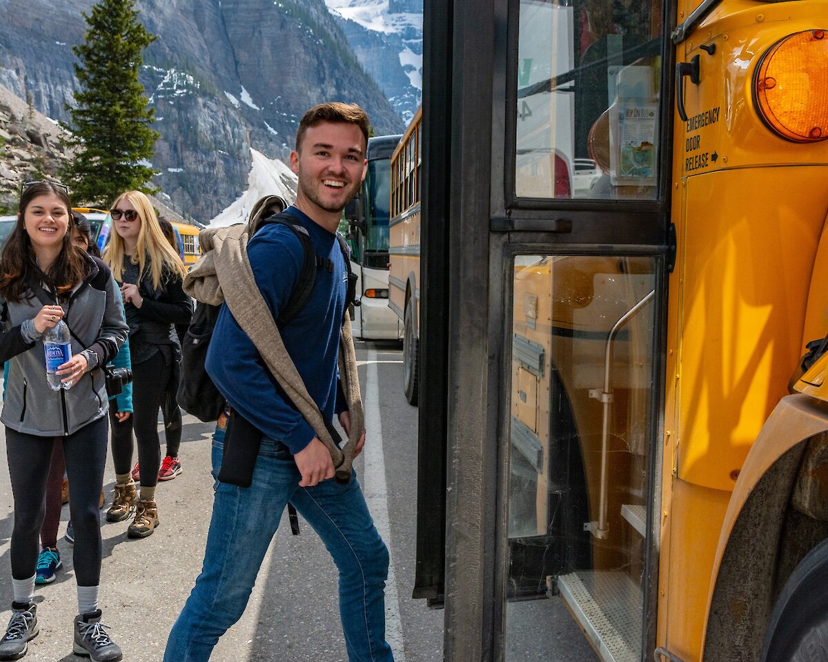 Hopping on the bus ready to go to Lake Louise