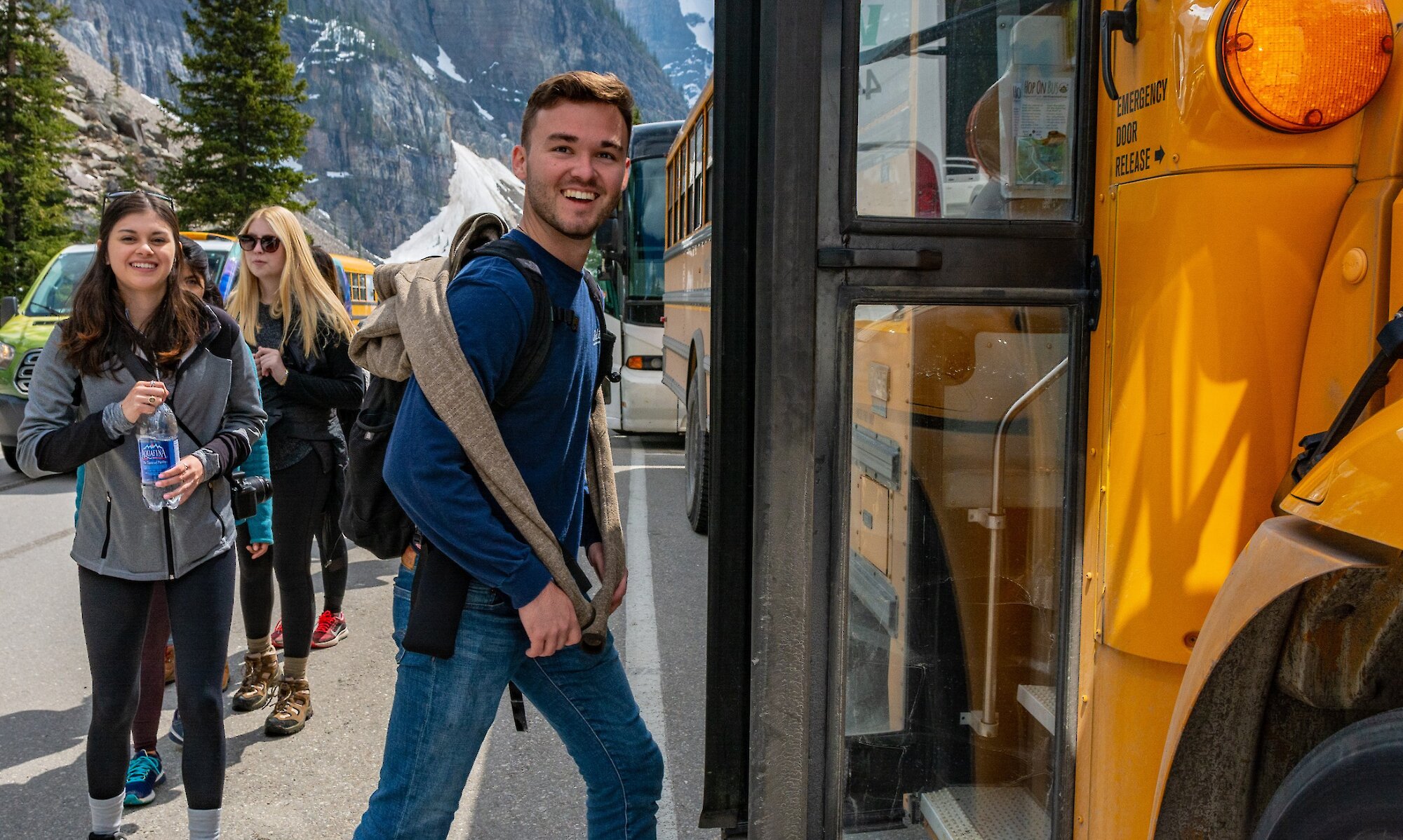 Hopping on the bus ready to go to Lake Louise