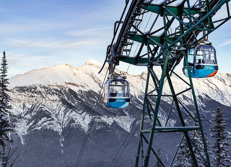 Banff gondola cars with mountain views over mount rundle