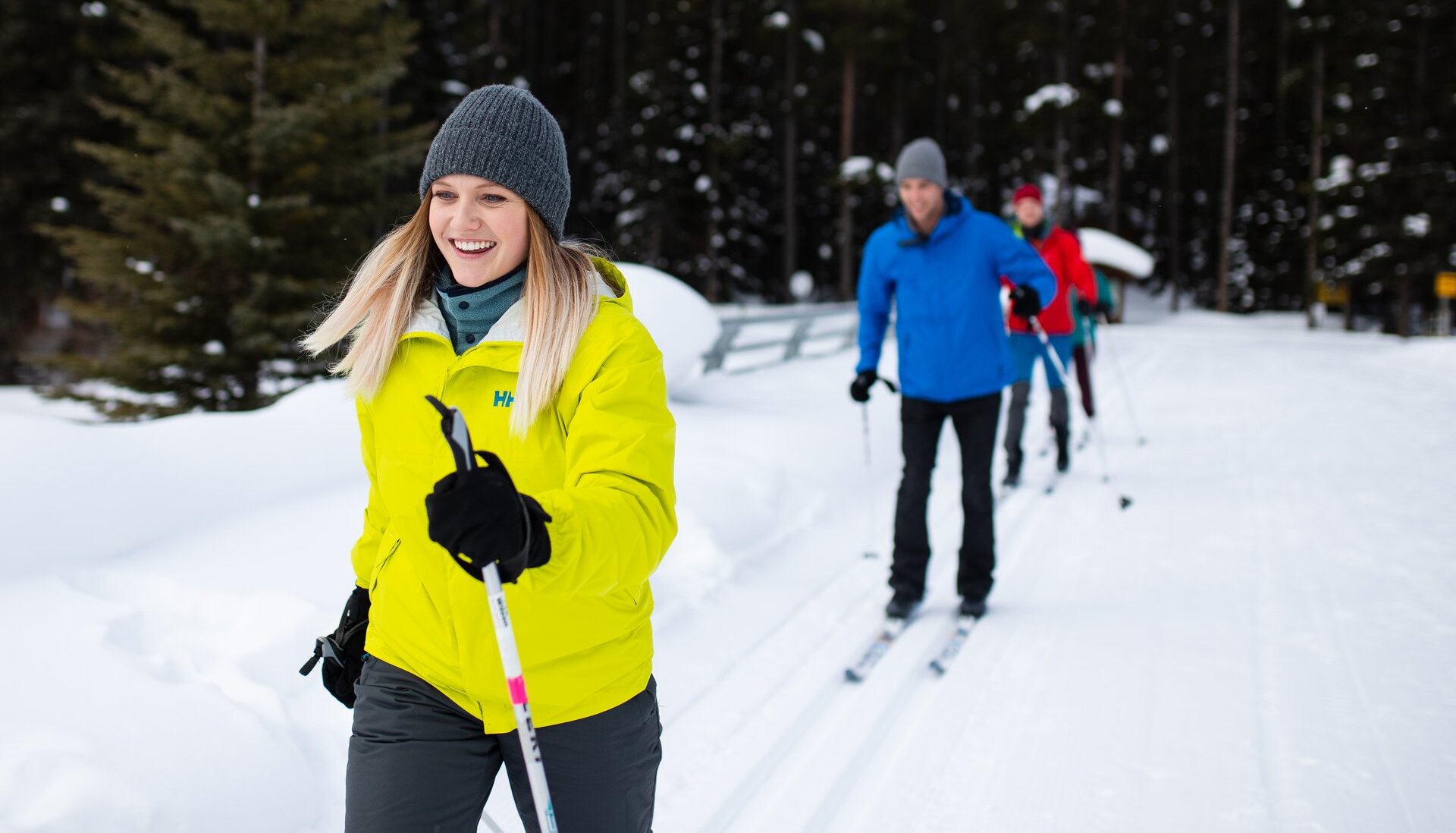 Group of friends cross country skiing at Lake Louise