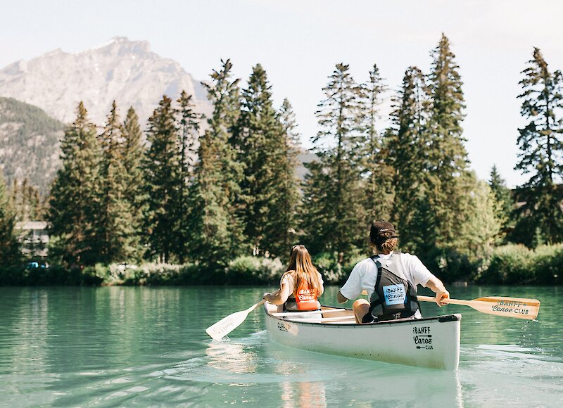 Couple enjoying a canoe on the Bow River in Banff