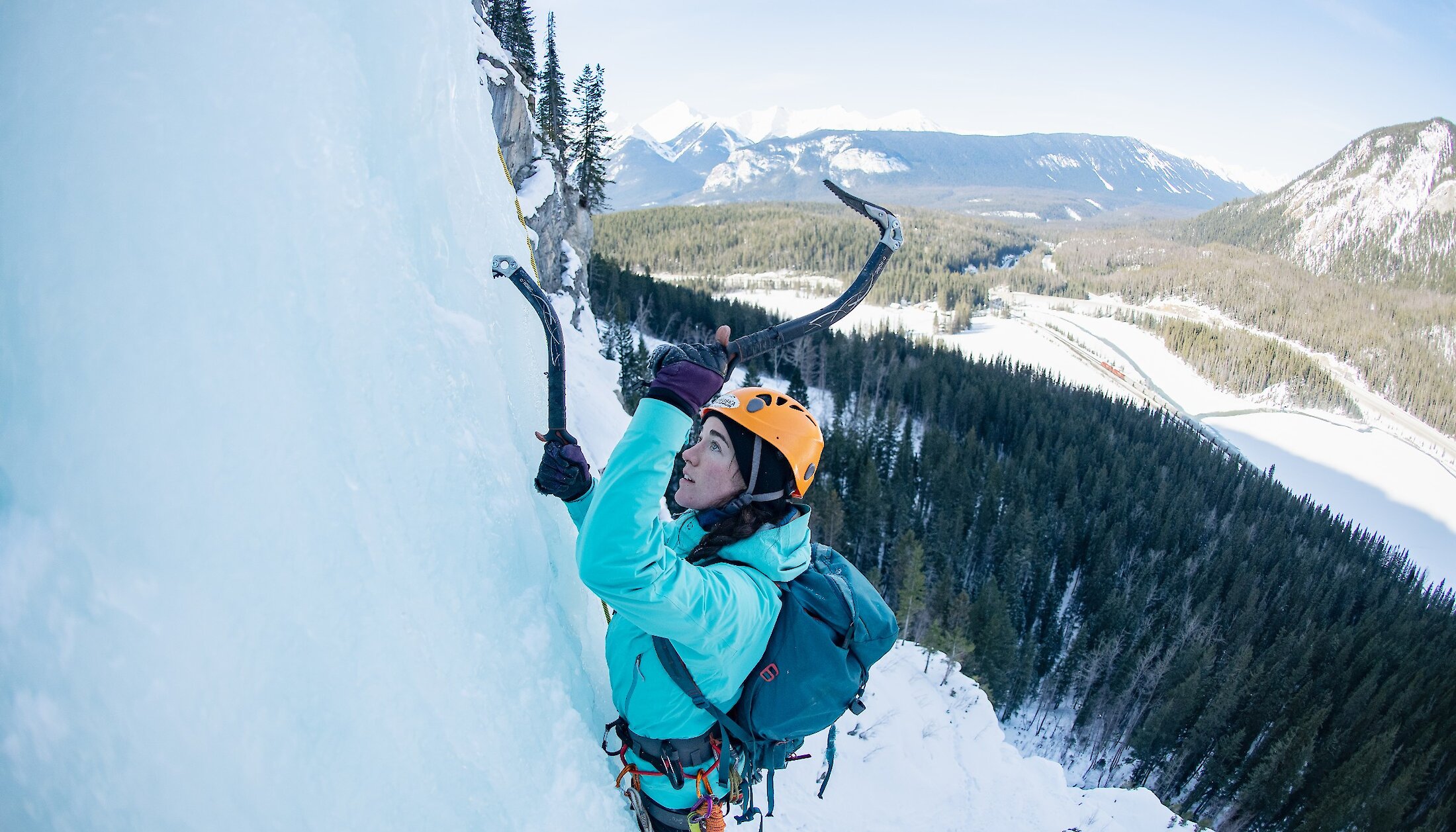 Ice Climber using ice picks to head up the ice fall