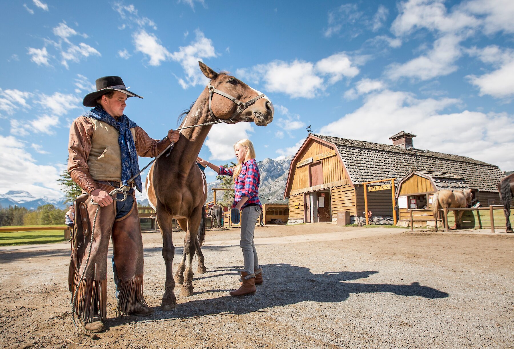 Petting the horses at the Warner stables in Banff